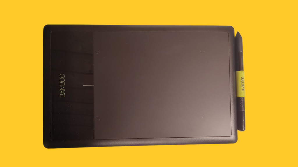 pen tablet drawing hand yellow